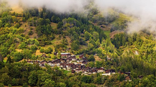 Fog over the mountain village of Pinsec, Val d'Anniviers, Valais Alps, Canton of Valais,