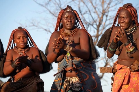 Himba woman dancing euphorically, traditional dance, traditional Himba village, Kaokoveld, Kunene,