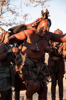 Himba woman dancing euphorically, traditional dance, traditional Himba village, Kaokoveld, Kunene,