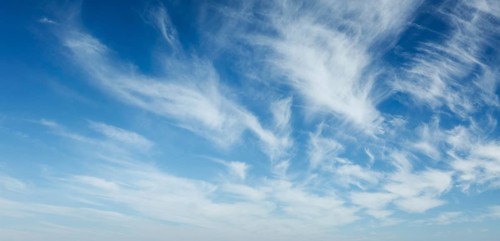 Clear Blue Sky with Whispy White Clouds - Perfect for Nature and Weather Backgrounds