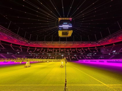 The Frankfurt Waldstadion (Deutsche Bank Park) is illuminated in red to mark the founding of the