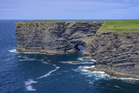 Cliff coast with rock arch, Kilkee, County Clare, Ireland