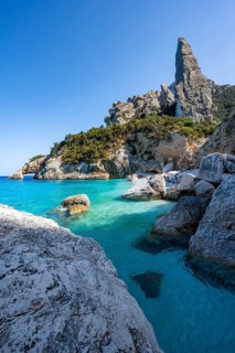 Light blue clear sea on a dream beach on Cala Goloritzé, picturesque rocky coast, steep coast with