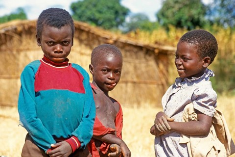 Children posing for the camera on the side of the road, Bwangu Mzimba, Malawi, Africa, June 2000,