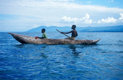 Two boys in a dugout on Lake Malawi, Malawi, Africa, July 2000, vintage, retro, old, historic