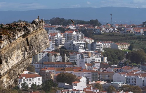 View from Leuct Tower towards orange tiled roofs in the town of Nazare, Estremadura, Portugal