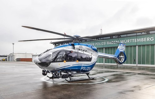 Helicopter from the Baden-Württemberg Police team in front of the hangar at the airport. Airbus