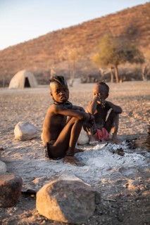 Himba children at the fire early in the morning, traditional Himba village, Kaokoveld, Kunene,