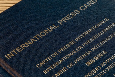 Close-up of an international press pass