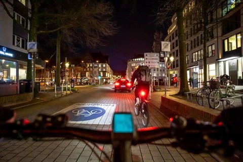 Cycling in the city, in the dark, in the evening, inner-city road, bicycle road, two-wheeler