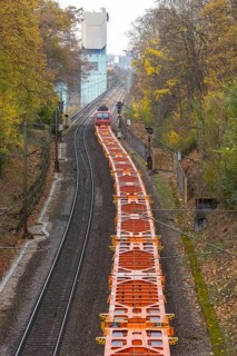 Freight train traveling on open route. Münster CHP plant. Stuttgart, Baden-Württemberg, Germany