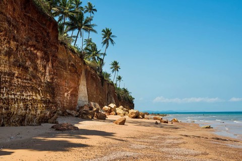 Lonely beach with red rocks and coconut trees, Red Cliffs, Bang Saphan Noi, Prachuap Khiri Khan