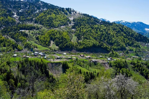 Dense forests on mountains with a small village away from the hustle and bustle, village in the