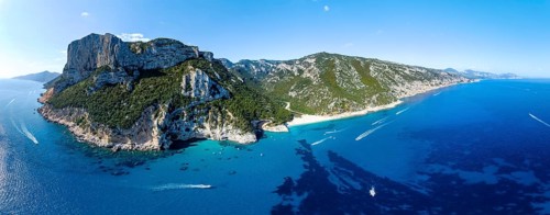 Picturesque rocky coast, cliffs and Cala Sisine beach, aerial view, Golfo di Orosei, Baunei,