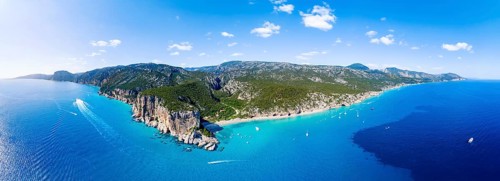 Picturesque rocky coast, cliffs and Cala Luna beach, aerial view, Golfo di Orosei, Baunei,