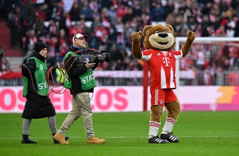 Mascot Berni FC Bayern Munich FCB (12) with TV team, TV camera, Allianz Arena, Munich, Bavaria,