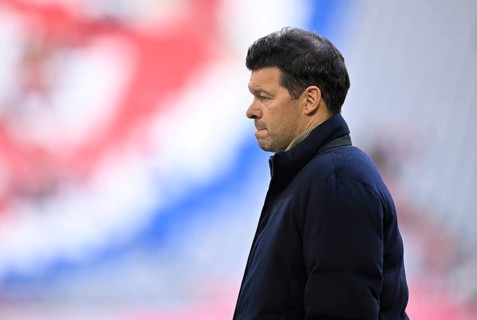 TV expert Michael Ballack in front of Logo FC Bayern Munich, thoughtful Allianz Arena, Munich,