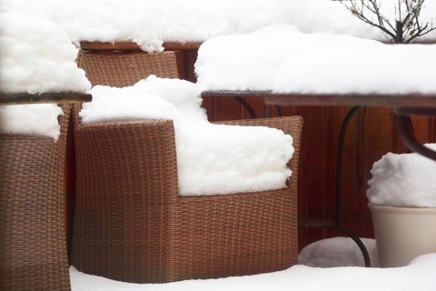 Snow-covered garden chairs, winter, Germany