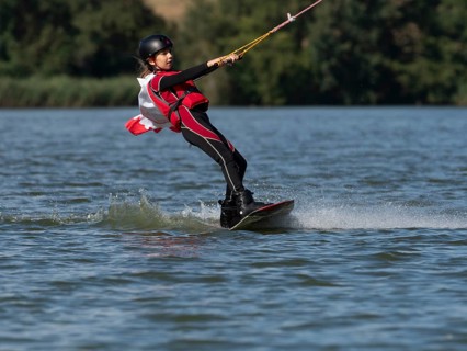 Boy or girl with wakeboard, sporty on the water, active water sports, wake park