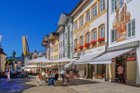Historic market street with street cafe and typical gabled houses, Bad Tölz. Isartal, Upper