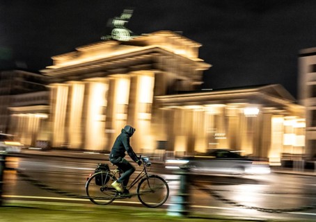 Cyclists, evening traffic on Ebertstraße, on March 18, at Brandenburg Gate, Berlin, Germany
