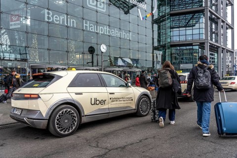 Uber taxi in front of the main train station in Berlin, waiting in line for passengers, Germany