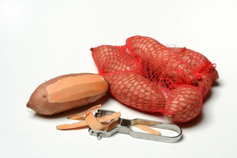 Sweet potato with potato peeler, Ipomoea batatas