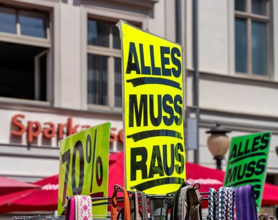 Retail trade with signs for price reductions and discounts, Potsdam, Brandenburg, Germany