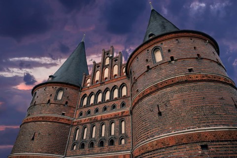 Holstentor, historic city gate from 1478, evening sky, Holstentorplatz, Hanseatic City of Lübeck,