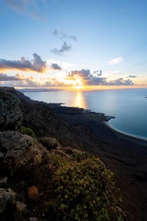 View of steep cliffs on sea and coast, Mirador del Porrito viewpoint at sunset, Lanzarote, Canary