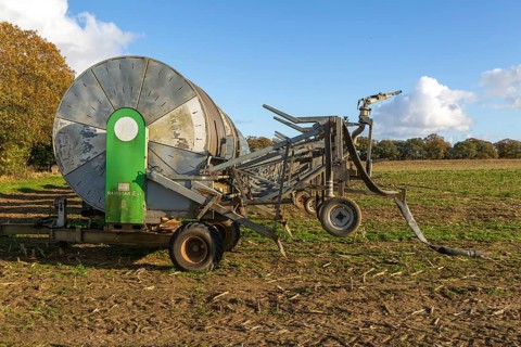 Rainstar E31 irrigation sprayer machinery in field, Shottisham, Suffolk, England, UK