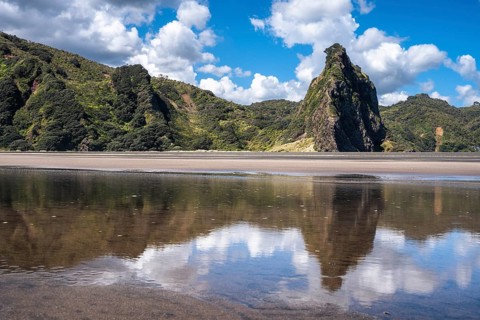 Landscape in New Zealand with sandy beach. Karekare Beach and The Watchman Rock. Karekare,