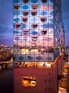 Aerial view of the Elbe Philharmonic Hall with reflections on the façade in the evening light above