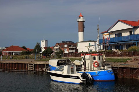 Timmendorf lighthouse on the island of Poel on the Baltic Sea, harbour in the foreground,