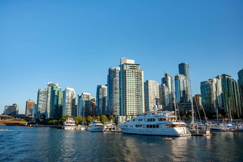 Sailing boats in marina, skyscrapers on the promenade, Coal Harbour, Vancouver, British Columbia,