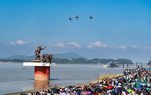The Indian Air Force aerobatic team performs during an air show as part of the 93rd Air Force Day