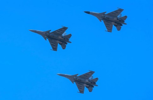 Indian Air Force aerobatic team performs during rehearsals ahead of the air show organised as part