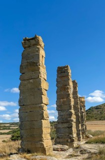Stone columns of ancient aqueduct, Roman site of Los Banales, near Layana, Zaragoza province,