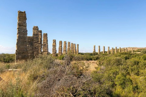 Stone columns of ancient aqueduct, Roman site of Los Banales, near Layana, Zaragoza province,