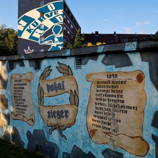 Painted wall on the Glückauf battle track with motifs of FC Schlake 04, Schalke, district of