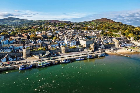 Conwy Castle over River Convy from a drone, Convy, North Wales, England, United Kingdom