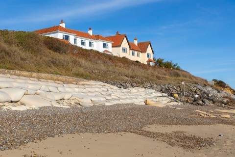 Clifftop houses at risk from coastal erosion, Thorpeness, Suffolk, North Sea coast, England, UK