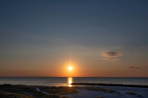 Sunset on the Baltic Sea with protective breakwaters, Darß, Ahrenshoop, Mecklenburg-Western