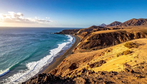 Desert landscape converges with ocean along a rugged coastal area, shore break at cliffs, blue