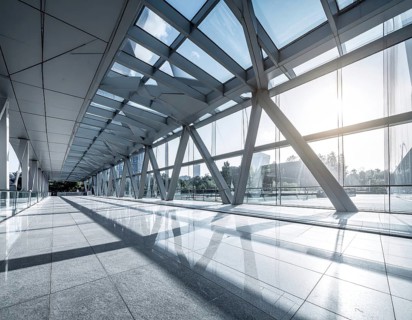 Modern architectural framework with glass and steel structure, glass facade with a greed of steel