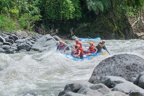 A group of people white water rafting, Costa Rica, Central America
