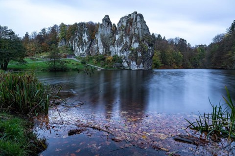 Externsteine in autumn, view over the Wiembecke pond, Teutoburg Forest, Horn-Bad Meinberg, North