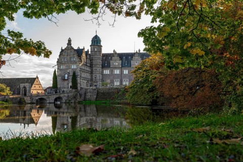 View across the castle pond to Hämelschenburg Castle, a moated castle and major work of the Weser