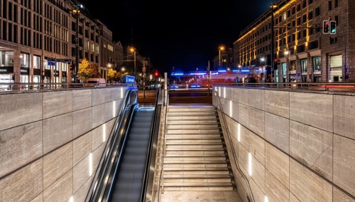 Night photo, long exposure with motion blur, modern underground entrance at Unter den Linden