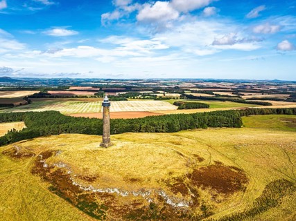 Waterloo Monument over Scottish fields and farms from a drone, Jedburgh, Scotland, UK